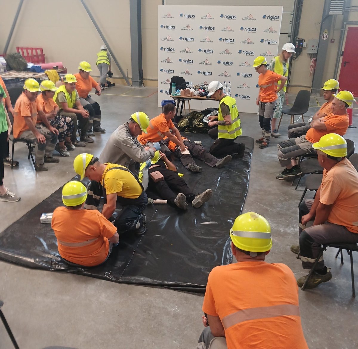 Factory workers practising Stop the Bleed